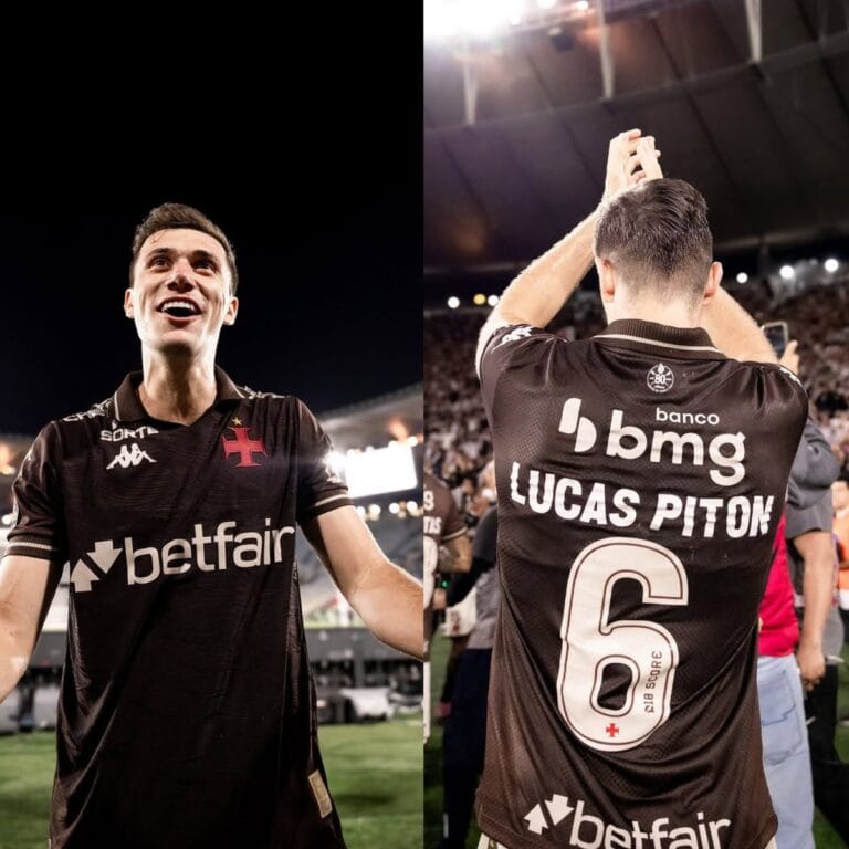 Goleiro do Vasco comemorando vitória, estádio lotado ao fundo.