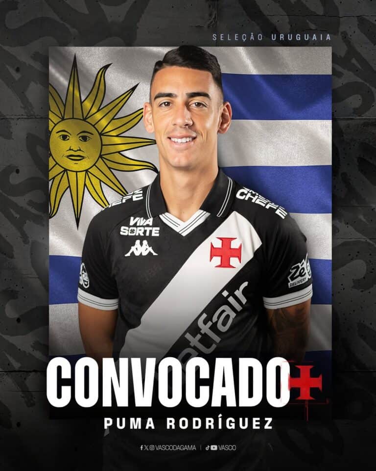 Jogador do Vasco com camisa oficial, fundo da bandeira do Uruguai.